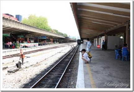 people taking pictures of the railway station before it disappears